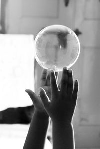 Close-up of hand holding ball