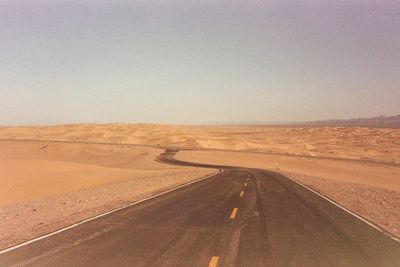 Scenic view of desert against clear sky