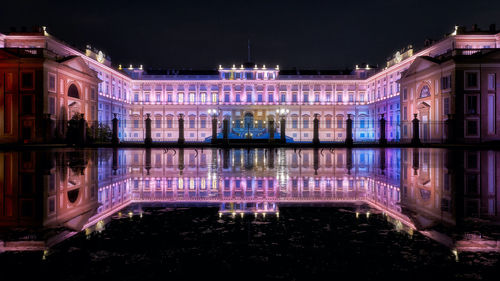 Illuminated buildings in city at night