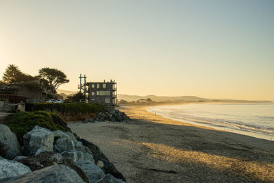 Scenic view of sea against clear sky during sunset