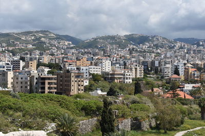 High angle view of buildings in city against sky