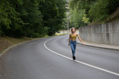 Full length of woman walking on road