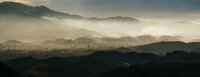 Panoramic view of mountains against sky during dawn