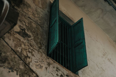 Low angle view of window on wall