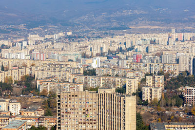 High angle view of buildings in city against sky