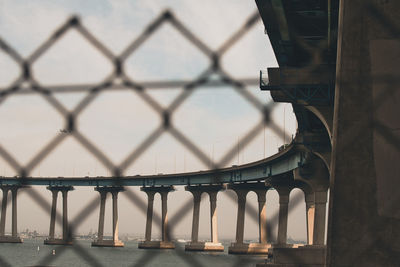 Bridge in city against sky