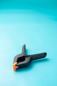 A big clamp on light blue background