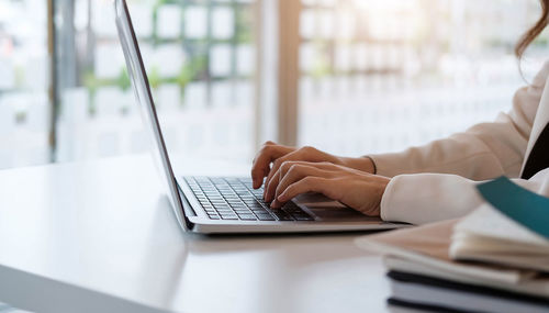 Low angle view of woman working on table