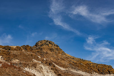 Himalayan breathtaking landscape with bright blue sky and twisty adventurous valley road