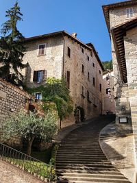 Staircase by building against sky