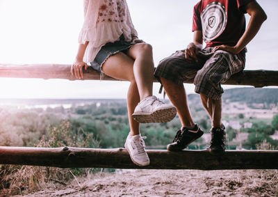 Low section of people sitting outdoors