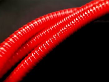 Close-up of metallic object over black background