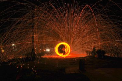 Light painting against sky at night