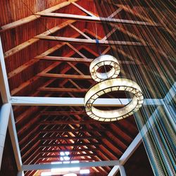 Low angle view of spiral hanging on ceiling of building