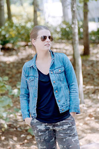 Young woman wearing sunglasses standing outdoors