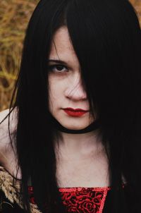 Close-up portrait of angry woman outdoors