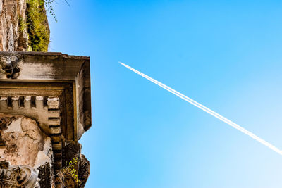 Low angle view of building against blue sky