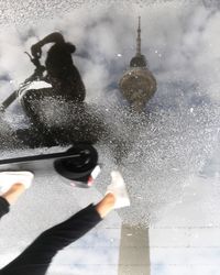 Reflection of people on glass during winter