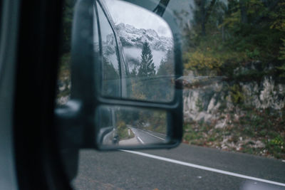 Reflection of car on side-view mirror