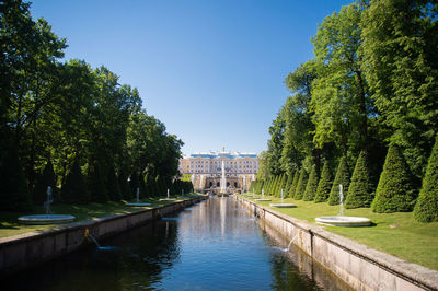 The canal in peterhof next to the samson fountain. peterhof palace and park ensemble, july 2022