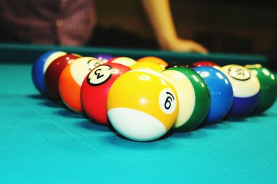 Close-up of multi colored balls on table