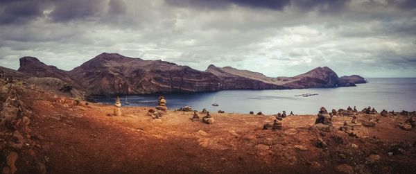 Scenic view of mountains against cloudy sky