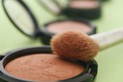 Close-up of make up brush with powder
