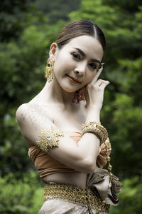 Portrait of young woman standing outdoors