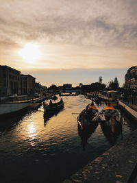 Boats moored in canal