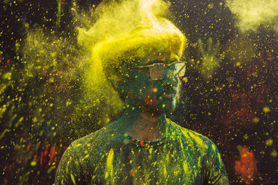 Close-up of man covered with powder paint during holi