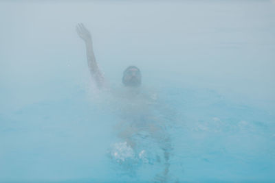 Man swimming in sea