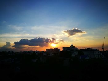 Cityscape against sky during sunset