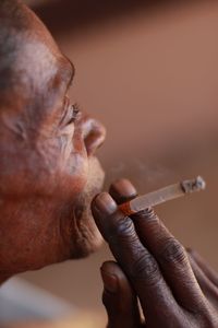 Cropped image of elderly woman smoking