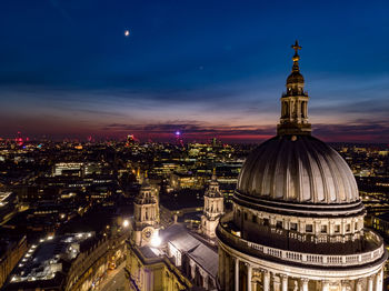 Illuminated cathedral in city at night