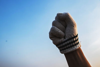 Low angle view of rope against blue sky