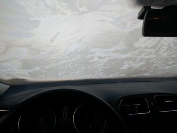 Car moving on road seen through windshield