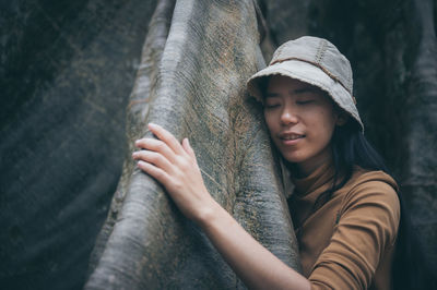 Portrait of young woman wearing hat