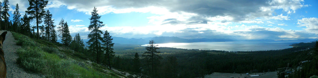 Scenic view of mountains against cloudy sky