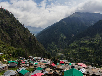 Scenic view of malana against mountains