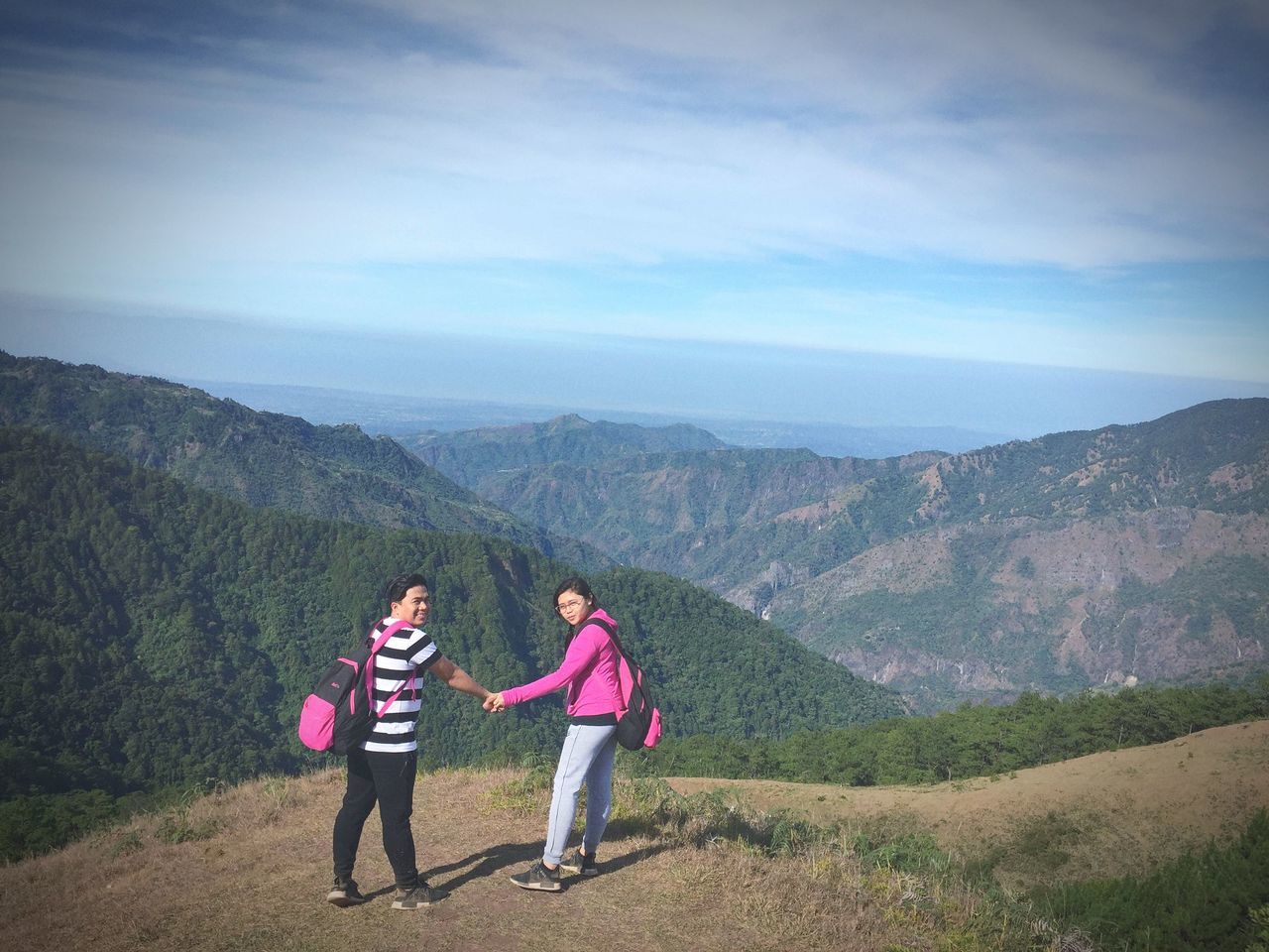 mountain, women, full length, scenics - nature, togetherness, two people, leisure activity, beauty in nature, sky, nature, real people, females, non-urban scene, day, adult, environment, lifestyles, casual clothing, idyllic, landscape, mountain range, outdoors, positive emotion