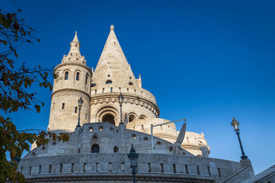 Low angle view of a building against blue sky