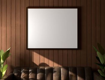 Empty chair against wall at home