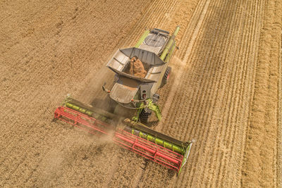 High angle view of agricultural machinery on field