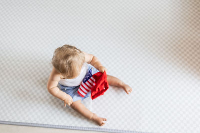 High angle view of boy playing in gym