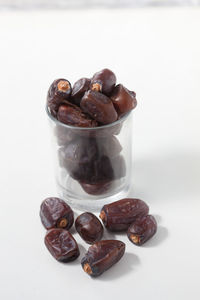 Close-up of coffee beans against white background