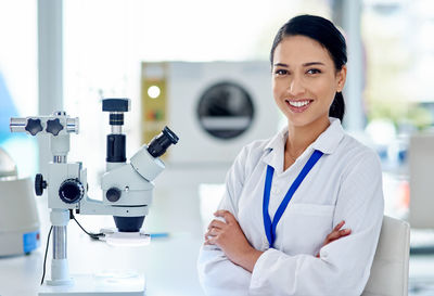 Portrait of doctor standing in laboratory