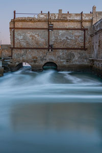 Surface level of old building against sky