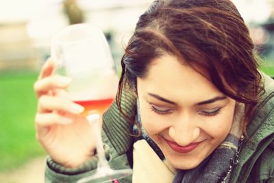 Portrait of young woman with wine 