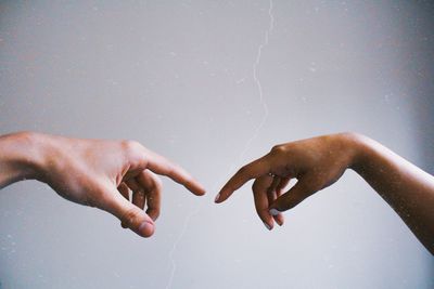 Midsection of couple holding hands