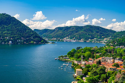 High angle view of townscape by sea against sky